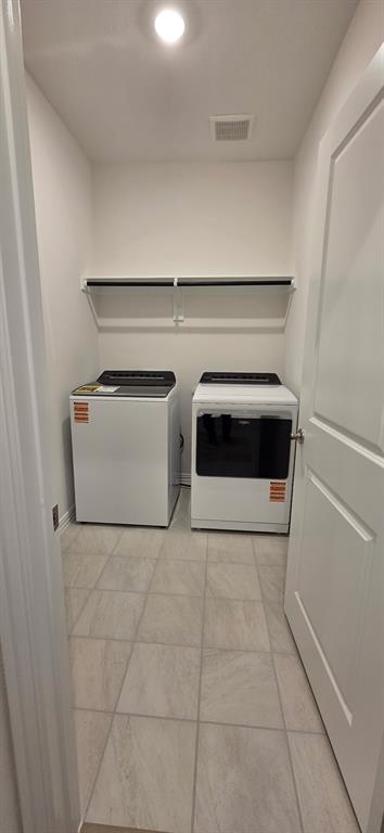 1733 Arches Road Anna, TX 75409 - Photo 9 of 17 a utility room with washer and dryer