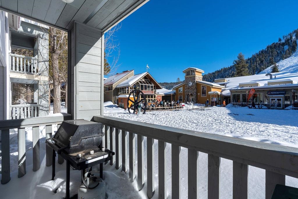 201 Shirley Cyn Road, Unit 714 Olympic Valley, CA 96146 - Photo 12 of 28 a view of a wooden chairs and table in a balcony