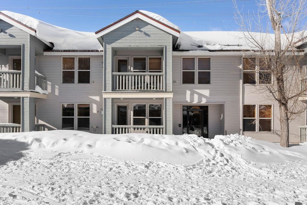 201 Shirley Cyn Road, Unit 714 Olympic Valley, CA 96146 - Photo 14 of 28 a front view of a house with a yard covered in snow
