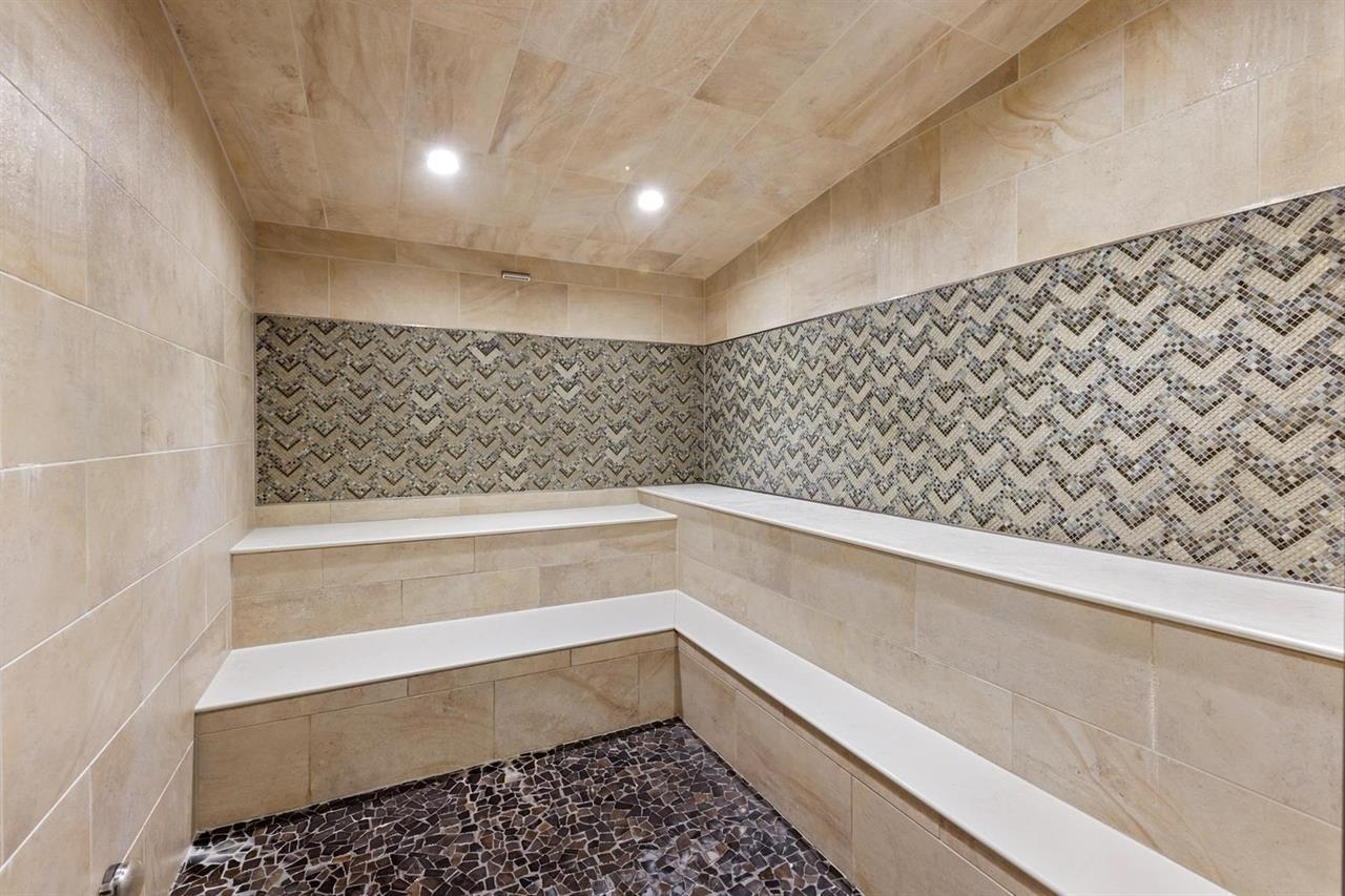 201 Shirley Cyn Road, Unit 714 Olympic Valley, CA 96146 - Photo 20 of 28 a bathroom with a bathtub and shower