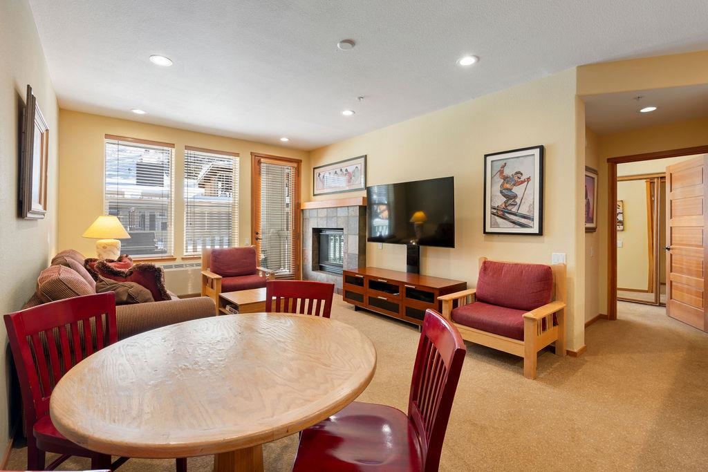 201 Shirley Cyn Road, Unit 714 Olympic Valley, CA 96146 - Photo 4 of 28 a living room with furniture and a flat screen tv