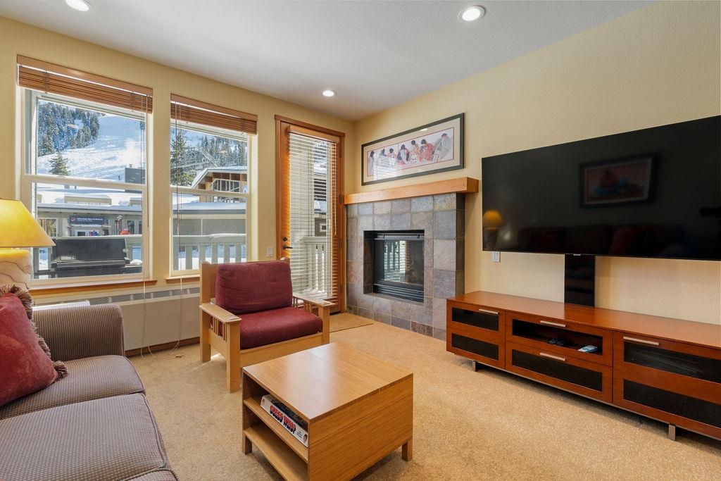 201 Shirley Cyn Road, Unit 714 Olympic Valley, CA 96146 - Photo 5 of 28 a living room with furniture fireplace and flat screen tv