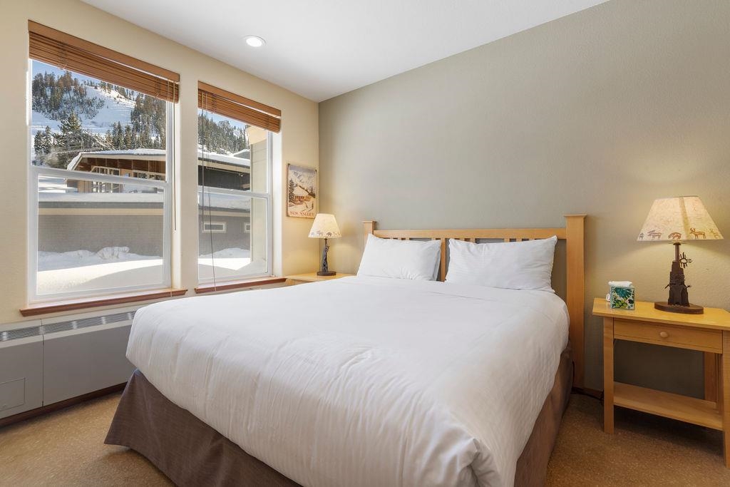 201 Shirley Cyn Road, Unit 714 Olympic Valley, CA 96146 - Photo 8 of 28 a bedroom with a bed and large window
