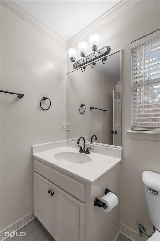 1663 Spencer Circle Benton, LA 71006 - Photo 32 of 40 a bathroom with a sink a toilet and mirror