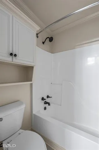 a bathroom with a toilet and a bathtub