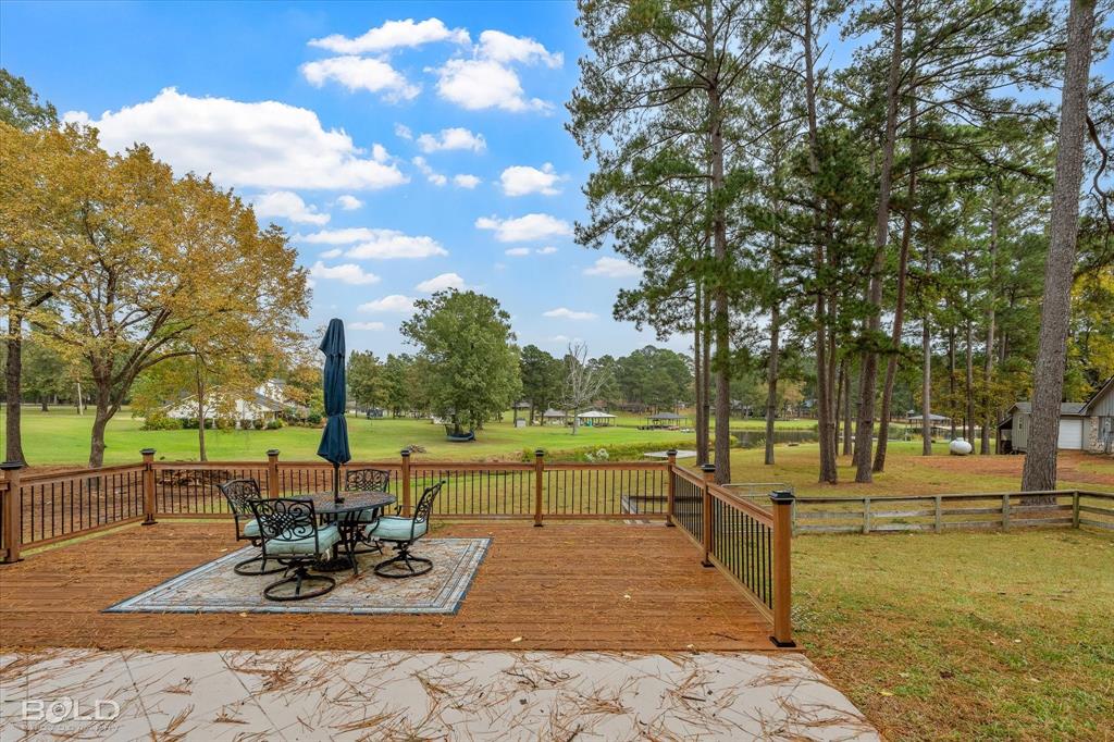 1663 Spencer Circle Benton, LA 71006 - Photo 8 of 40 a view of a lake with a patio
