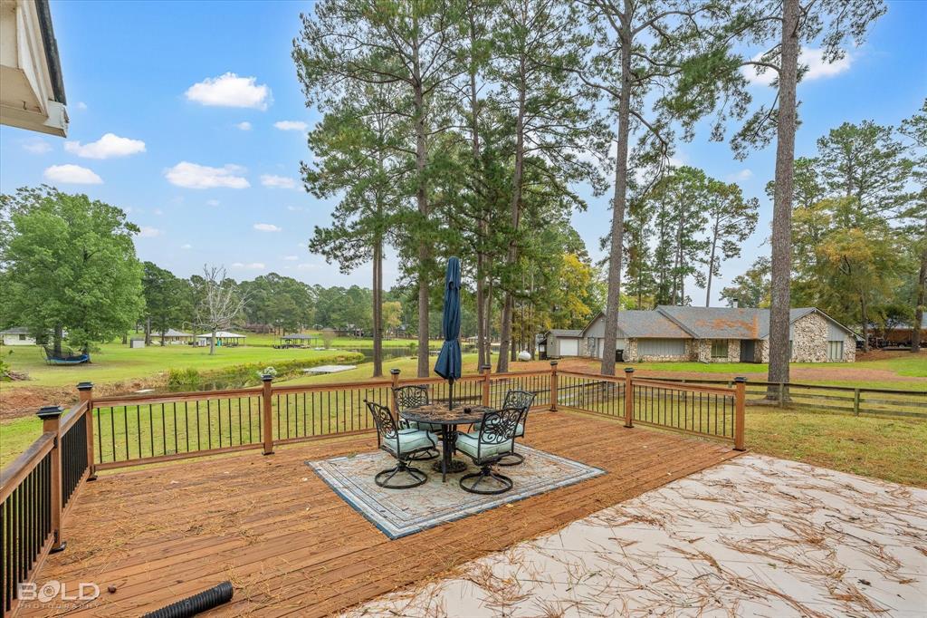 1663 Spencer Circle Benton, LA 71006 - Photo 9 of 40 a view of a lake with a patio