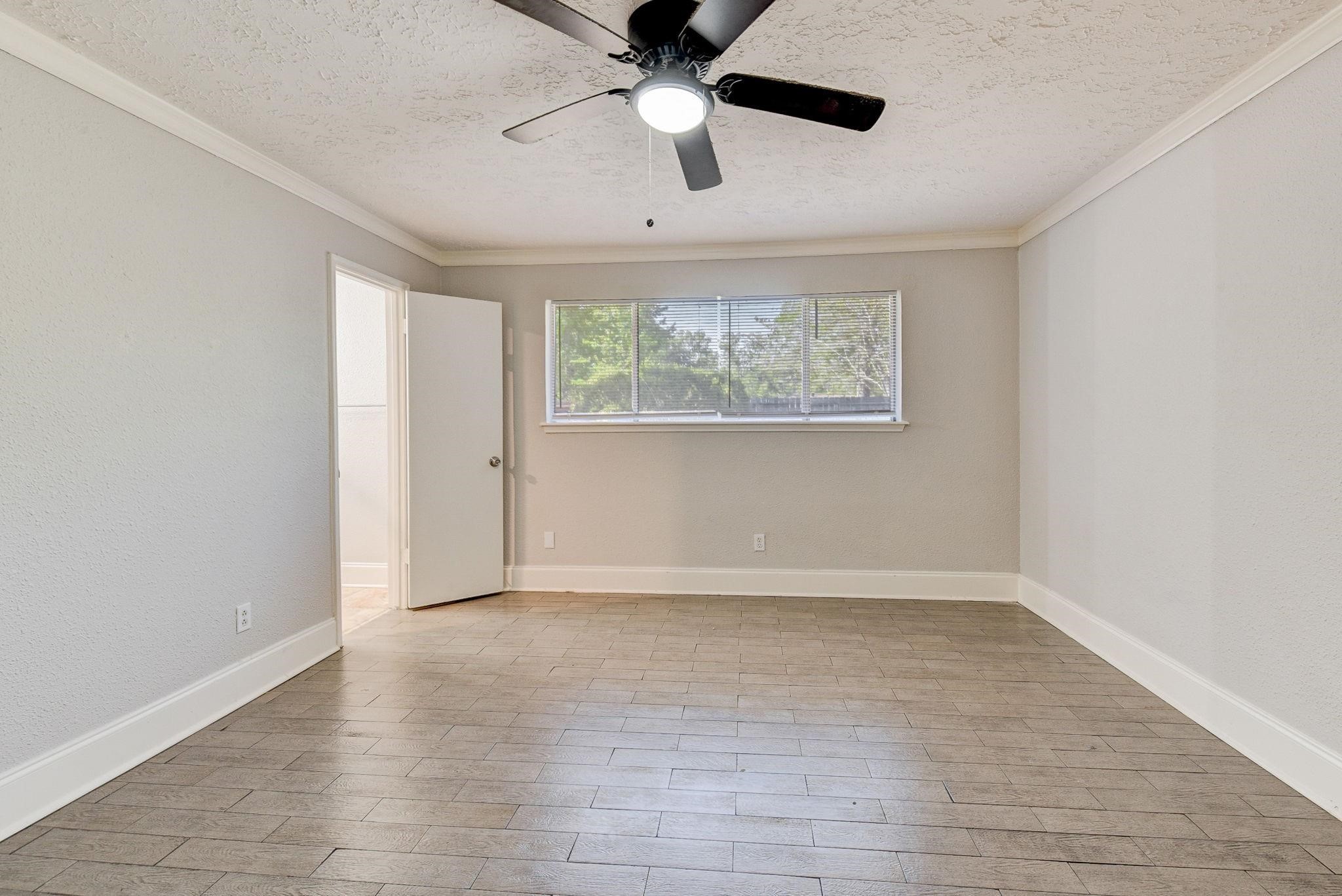 18015 Woodgum Drive Spring, TX 77388 - Photo 11 of 23 wooden floor in an empty room with a window