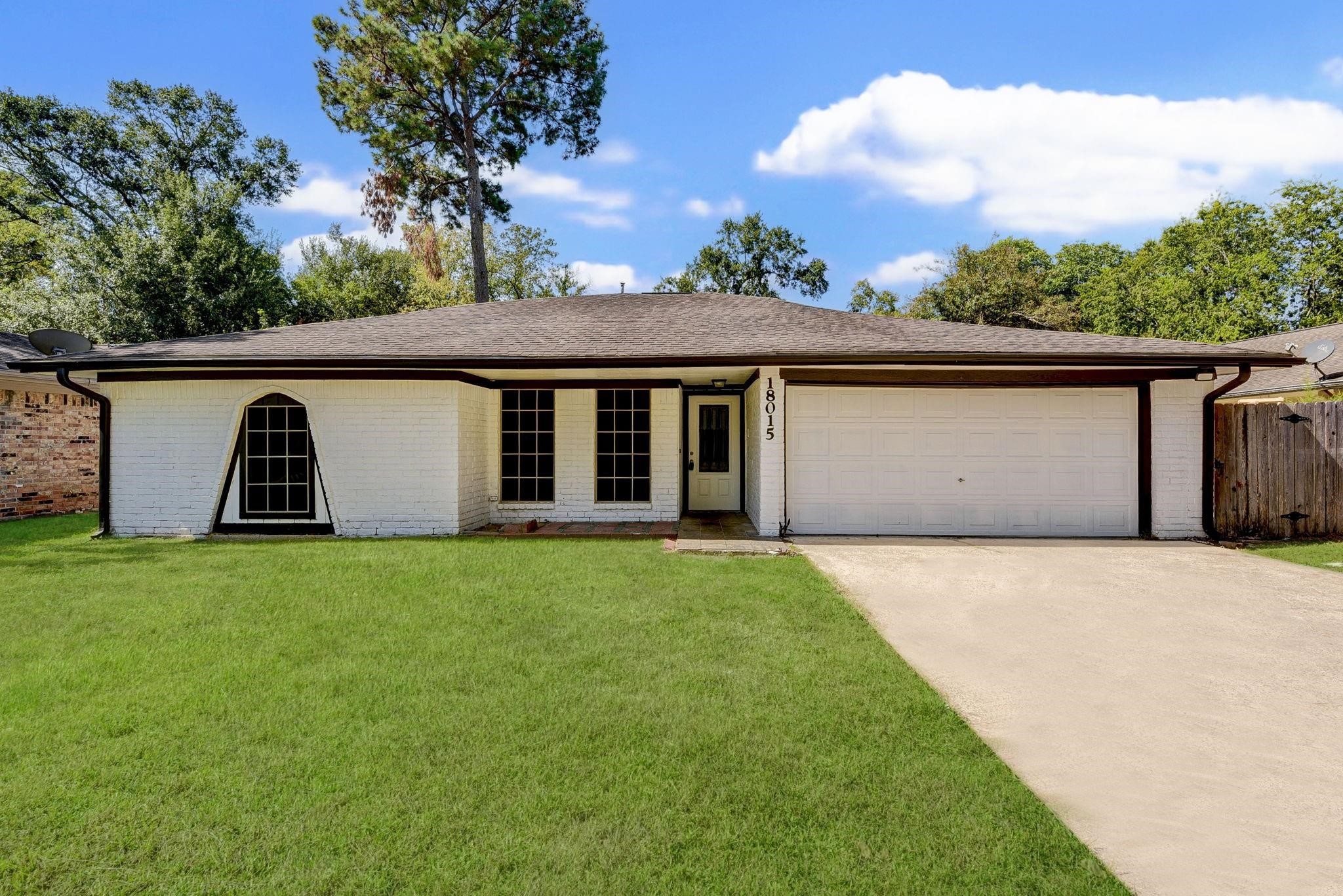 18015 Woodgum Drive Spring, TX 77388 - Photo 23 of 23 front view of house with a yard