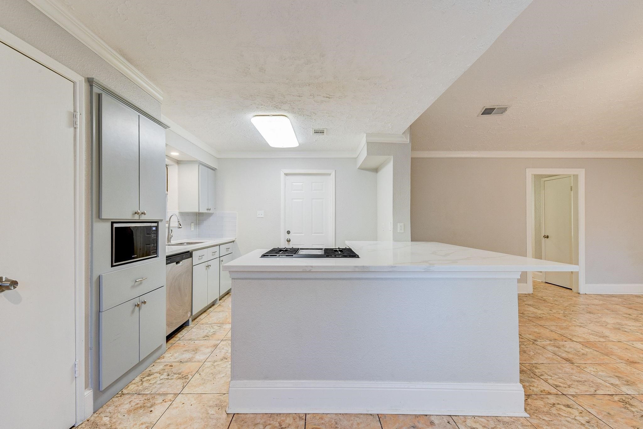 18015 Woodgum Drive Spring, TX 77388 - Photo 9 of 23 a view living room with stainless steel appliances kitchen island sink and stove
