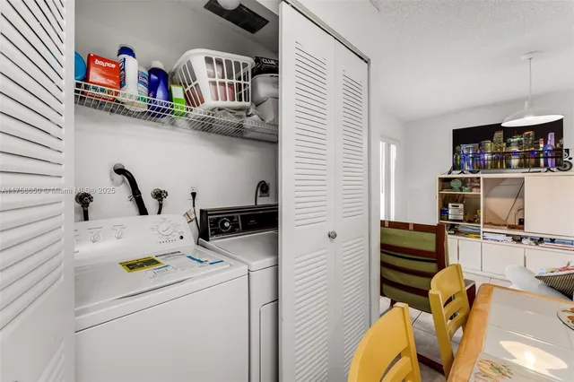 a storage room with washer and dryer