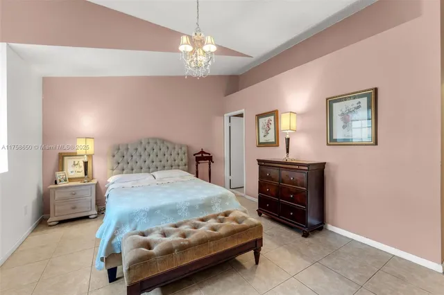 a bedroom with a bed and dresser