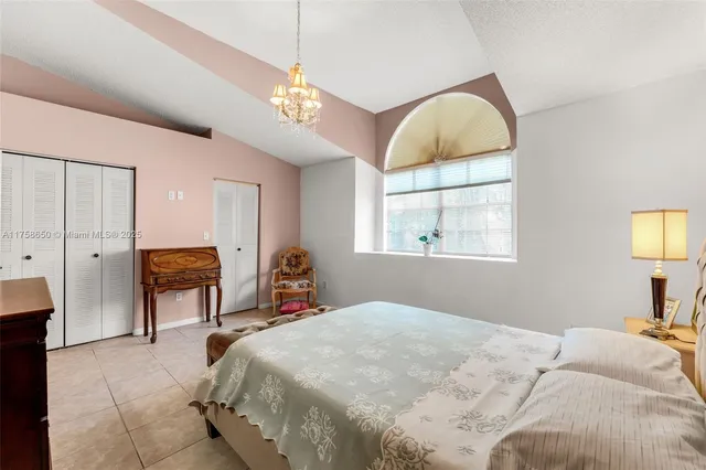 a bedroom with bed and window