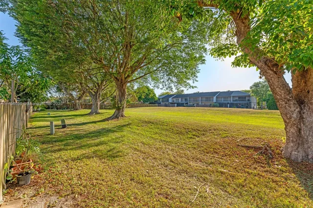 a view of a swimming pool with an outdoor space and seating area