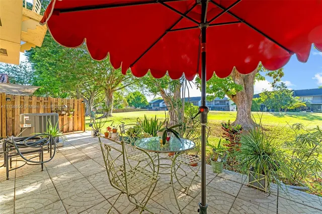 a view of an chairs and tables in the patio