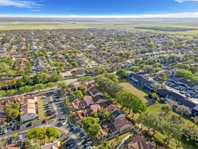 an aerial view of residential building and lake