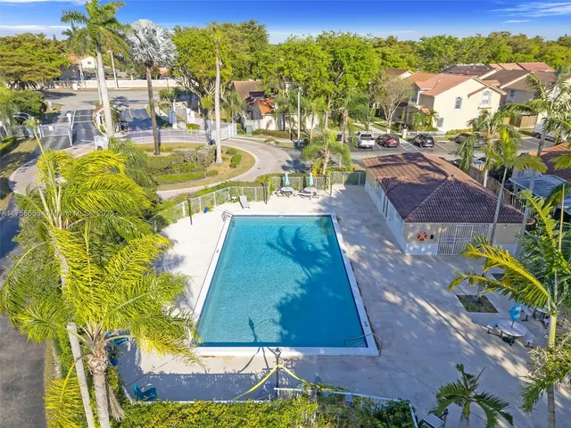 a view of a swimming pool with a patio