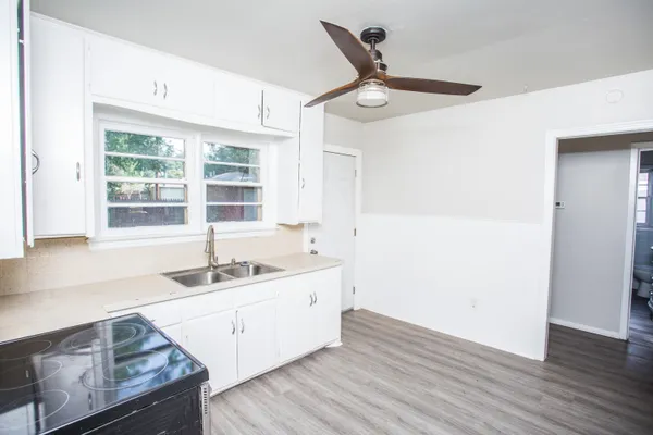 a kitchen with a sink and a window