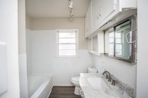 a bathroom with a sink and a bathtub