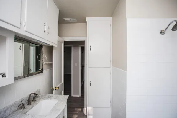 a bathroom with a sink and a mirror