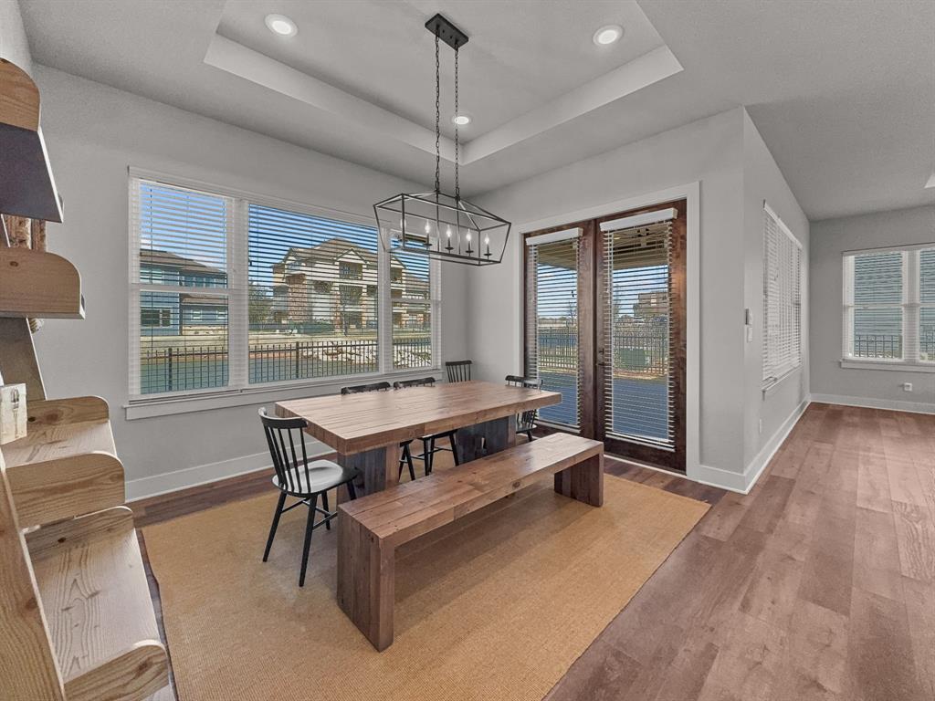 1044 Chapel Ridge Road Graford, TX 76449 - Photo 13 of 34 a view of a dining room with furniture wooden floor and chandelier