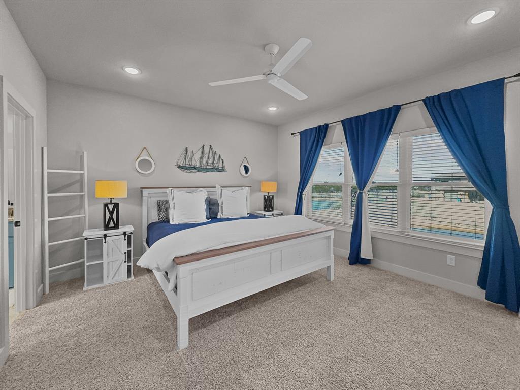 1044 Chapel Ridge Road Graford, TX 76449 - Photo 18 of 34 a bedroom with a large bed and a window