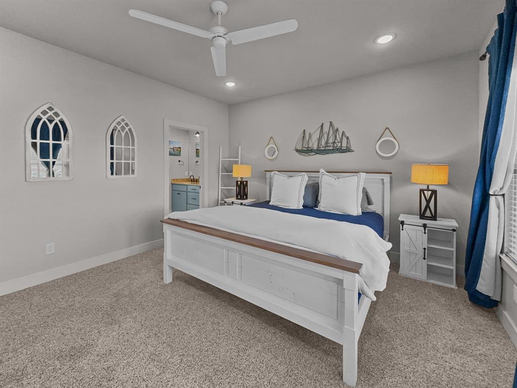 1044 Chapel Ridge Road Graford, TX 76449 - Photo 19 of 34 a bed room with a bed and a night stand