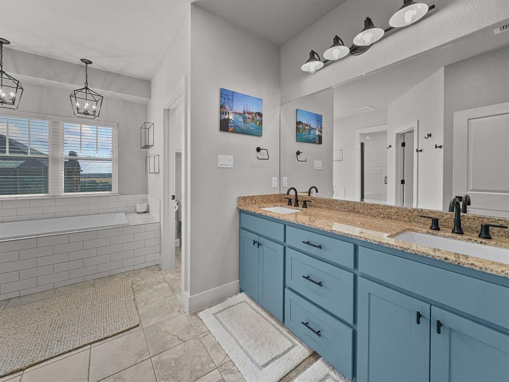 1044 Chapel Ridge Road Graford, TX 76449 - Photo 20 of 34 a spacious bathroom with double sink and a mirror