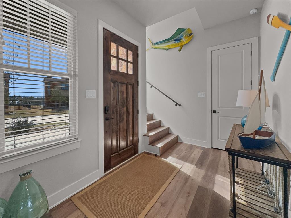 1044 Chapel Ridge Road Graford, TX 76449 - Photo 4 of 34 a view of entryway and hall with wooden floor