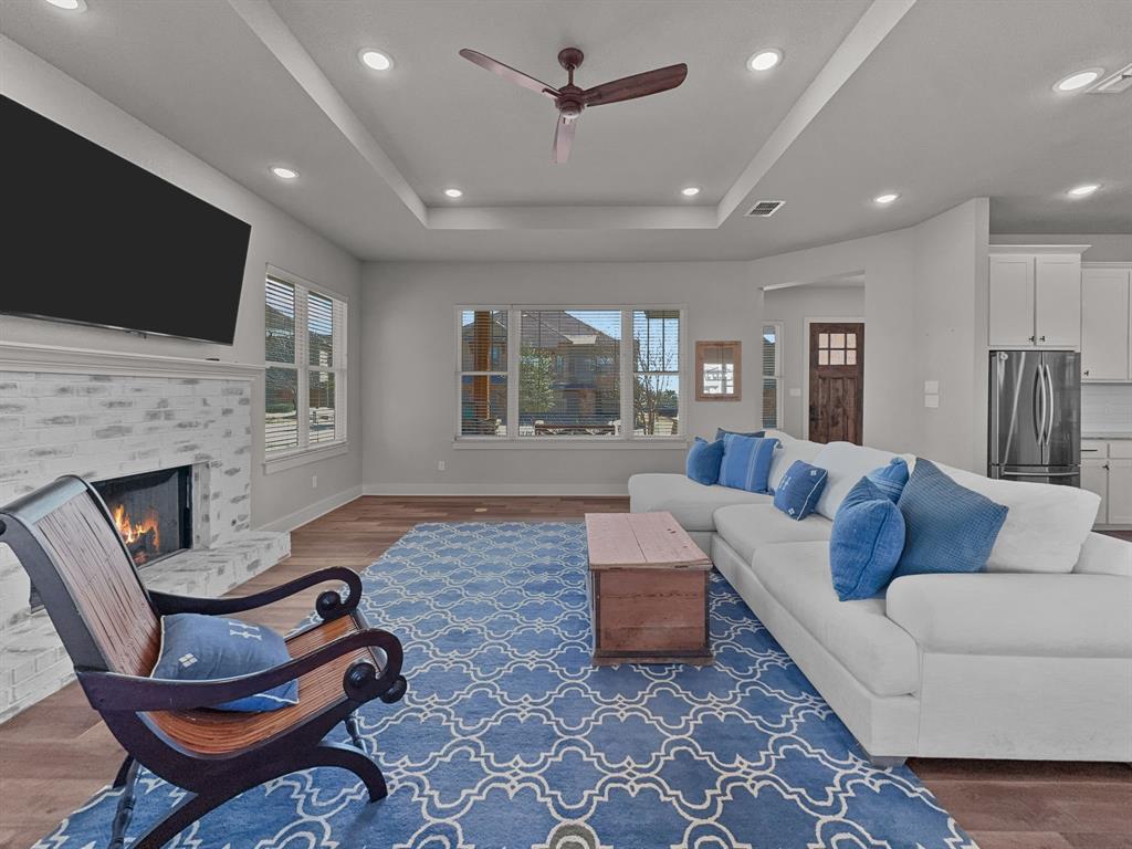 1044 Chapel Ridge Road Graford, TX 76449 - Photo 8 of 34 a living room with fireplace furniture and a flat screen tv