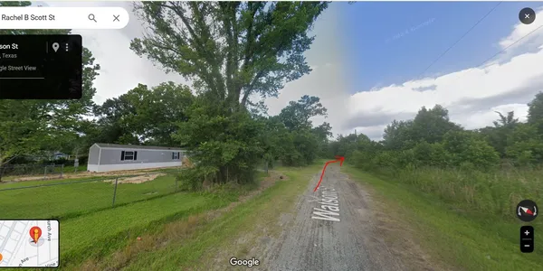 a view of a lake with a yard