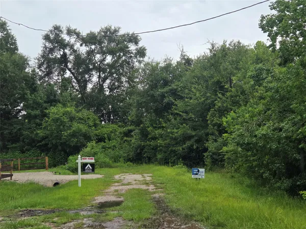 a view of a street with a sign board