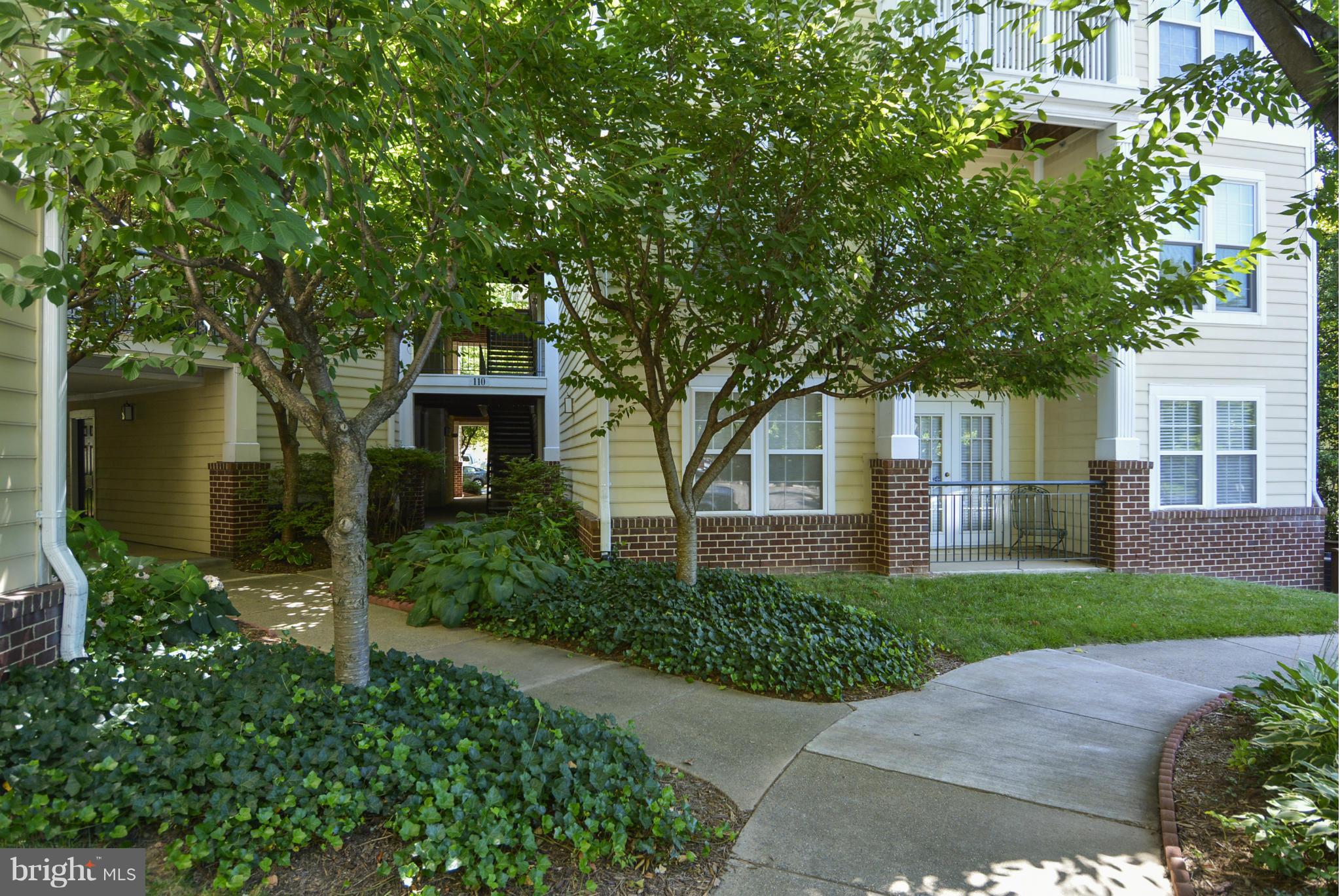 110 Booth Street, Unit 28 Gaithersburg, MD 20878 - Photo 1 of 30 front view of a house with a yard
