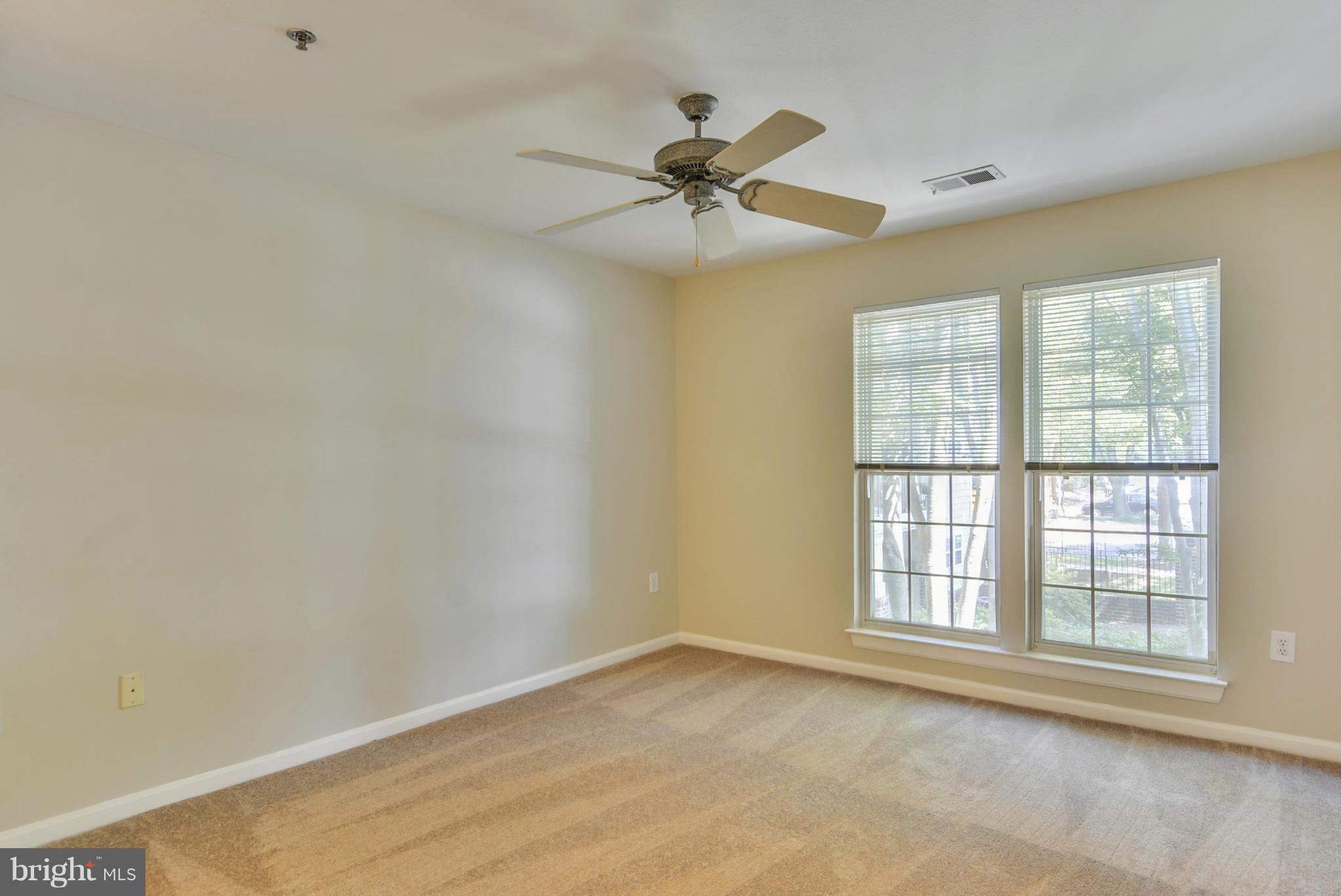 110 Booth Street, Unit 28 Gaithersburg, MD 20878 - Photo 11 of 30 an empty room with a window and a fan