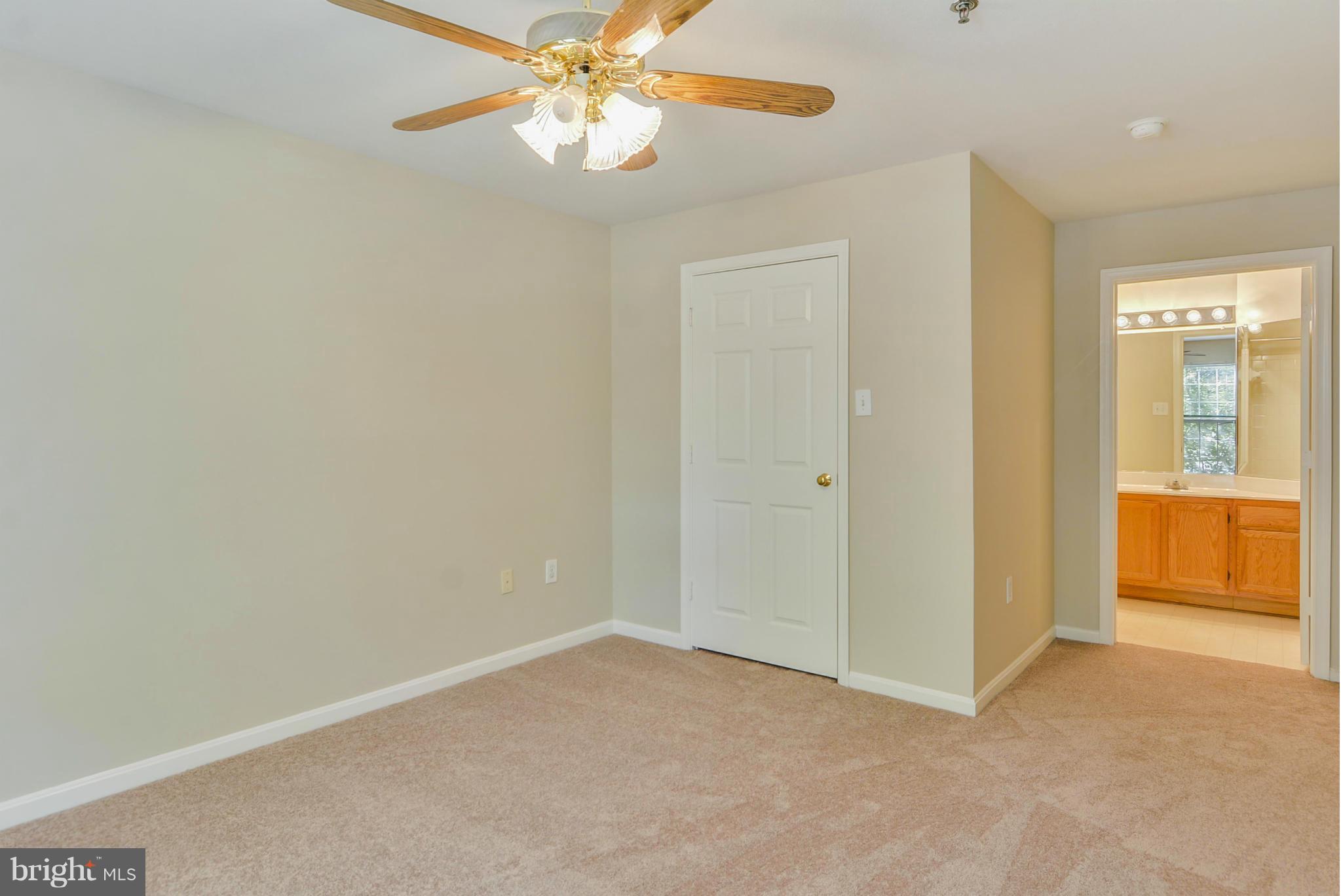 110 Booth Street, Unit 28 Gaithersburg, MD 20878 - Photo 16 of 30 an empty room with chandelier fan
