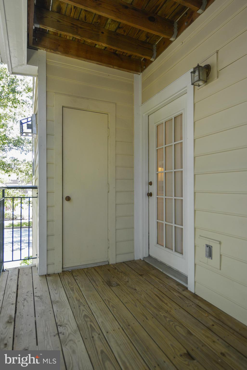 110 Booth Street, Unit 28 Gaithersburg, MD 20878 - Photo 21 of 30 an empty room with wooden floor and windows