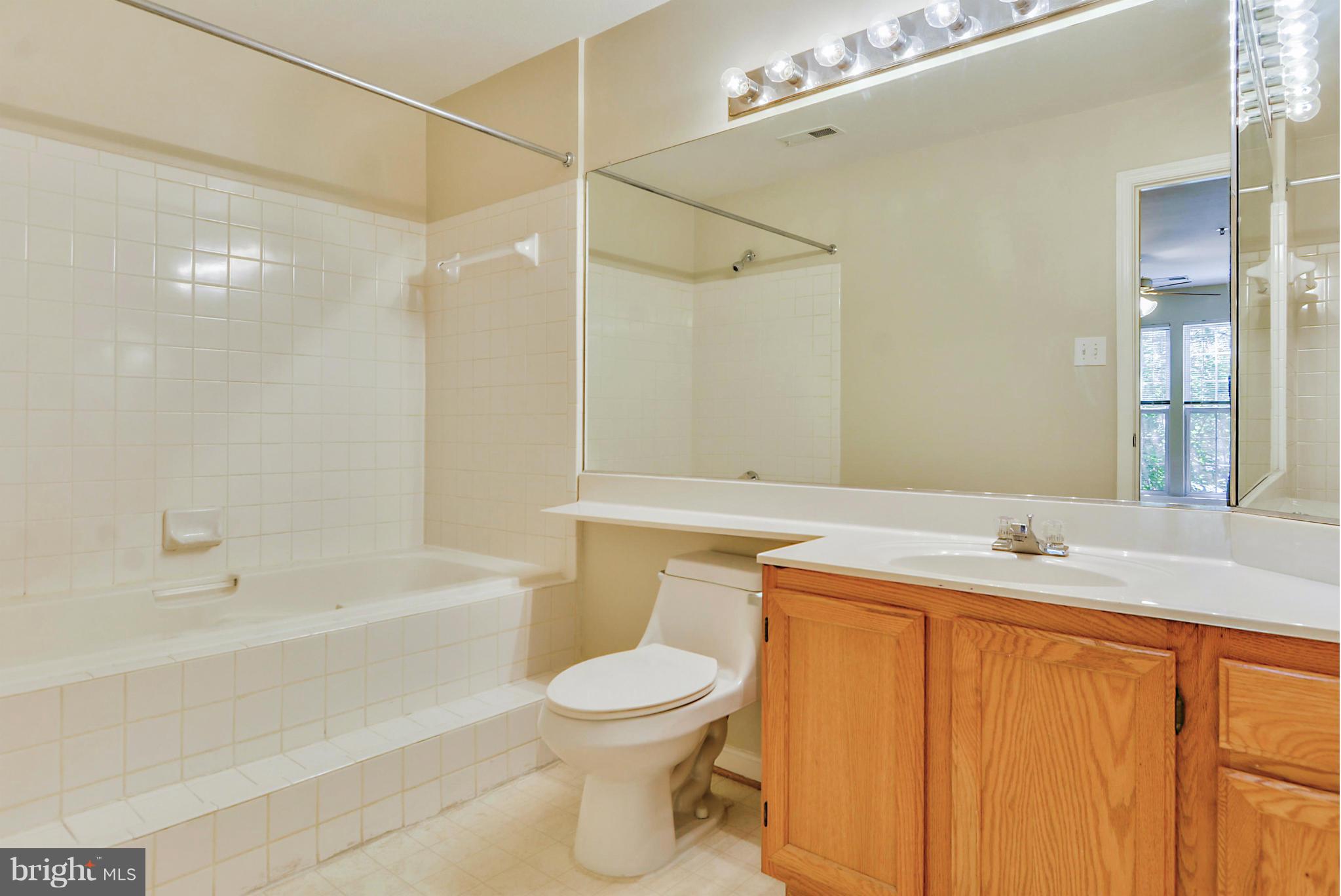 110 Booth Street, Unit 28 Gaithersburg, MD 20878 - Photo 9 of 30 a bathroom with a sink a toilet and shower