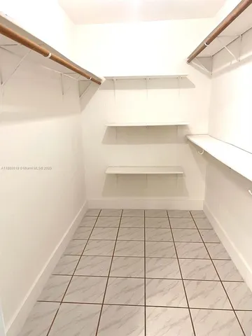 a view of a room with white walls