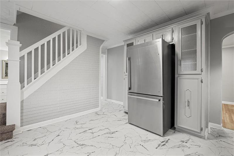 803 Little Deer Creek Valley Road Russellton, PA 15076 - Photo 13 of 46 a view of a refrigerator in kitchen and an empty room