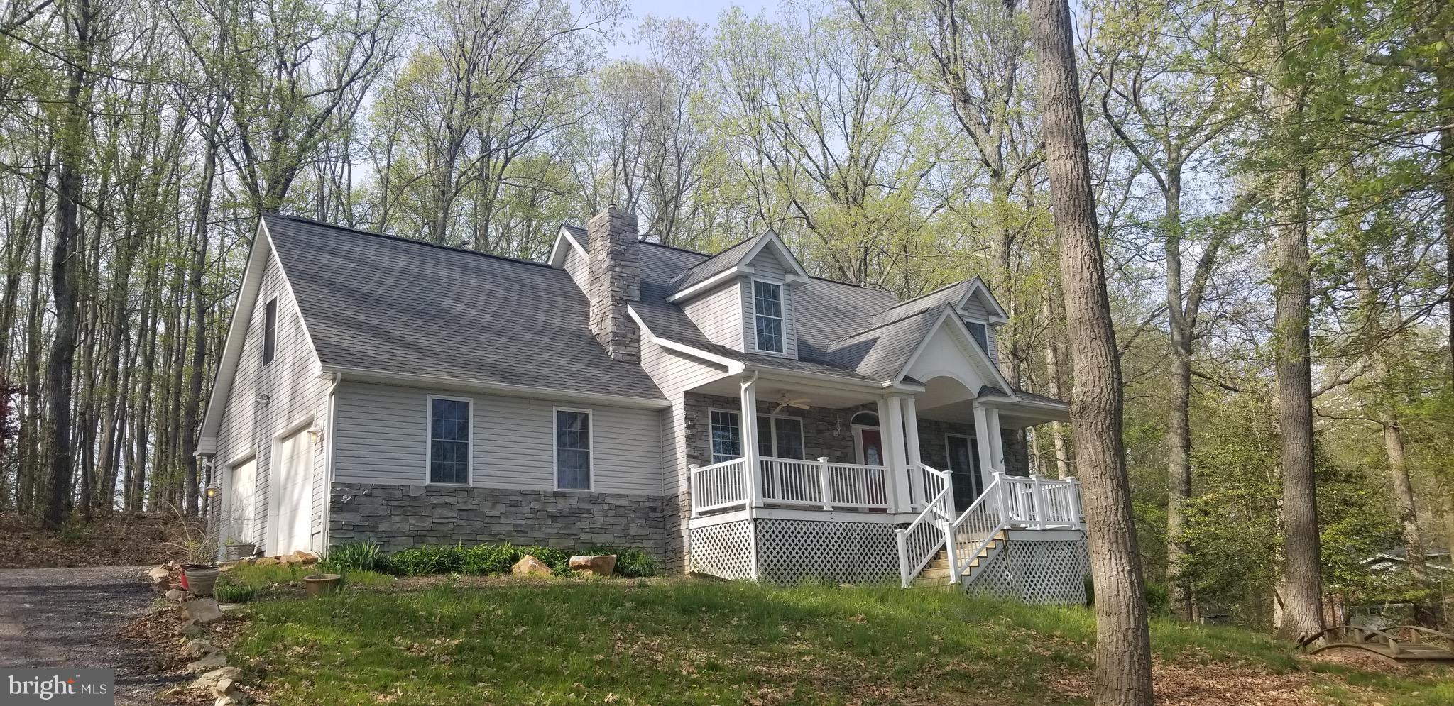 15825 Yeoho Road Sparks, MD 21152 - Photo 1 of 30 front view of house with a yard