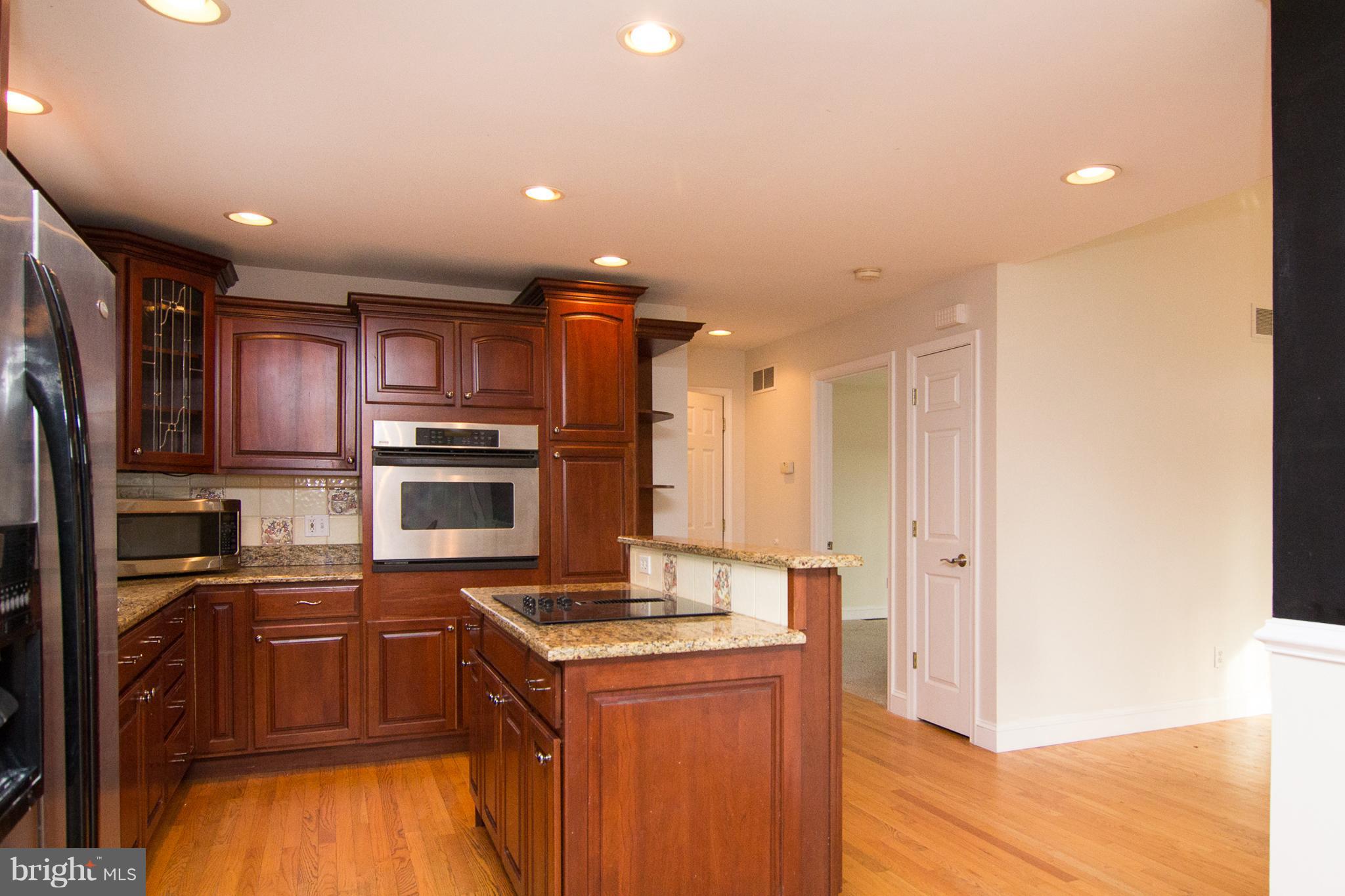 15825 Yeoho Road Sparks, MD 21152 - Photo 12 of 30 a kitchen with a refrigerator sink and stove