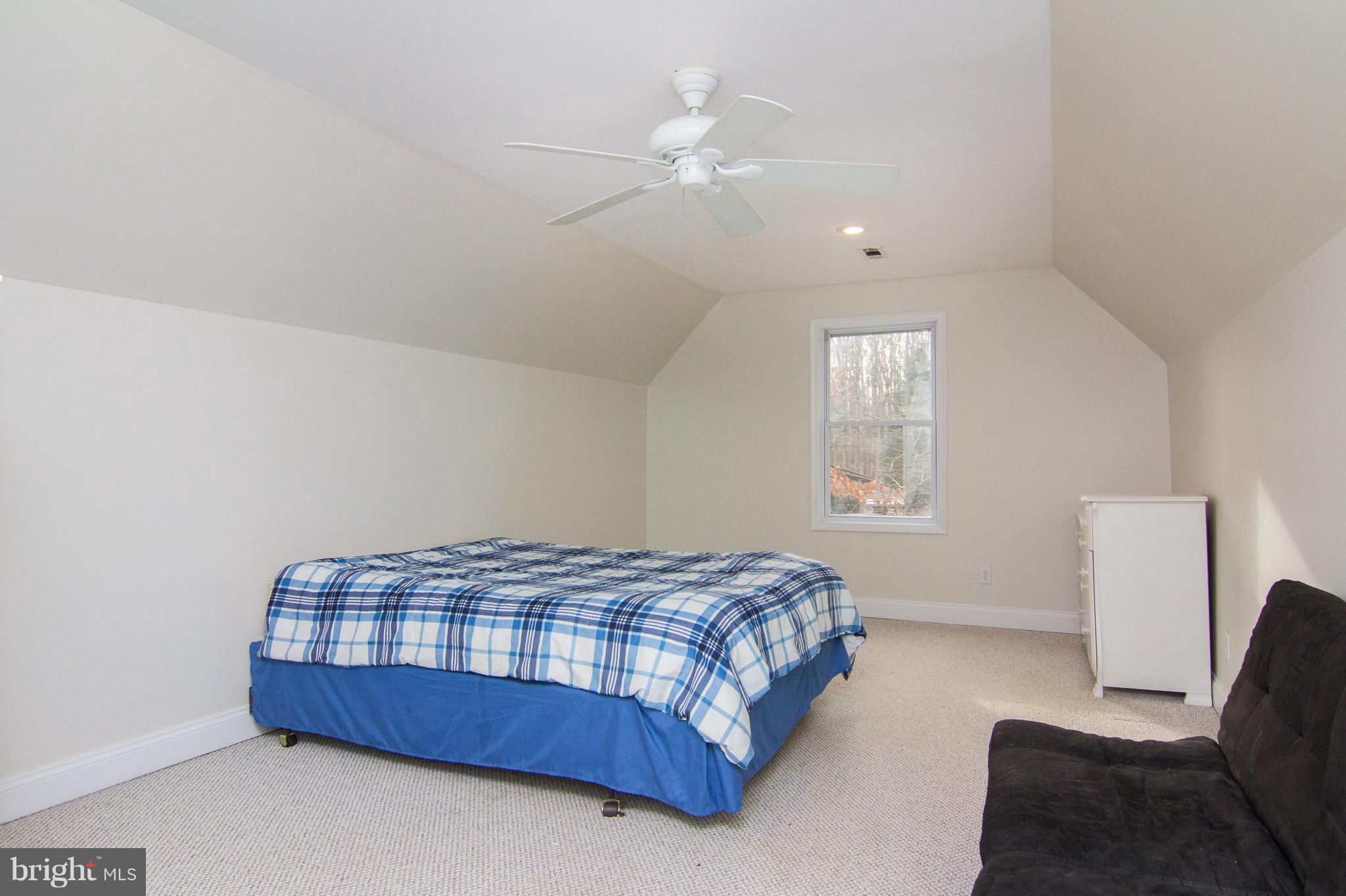 15825 Yeoho Road Sparks, MD 21152 - Photo 17 of 30 a bedroom with a bed and a chair