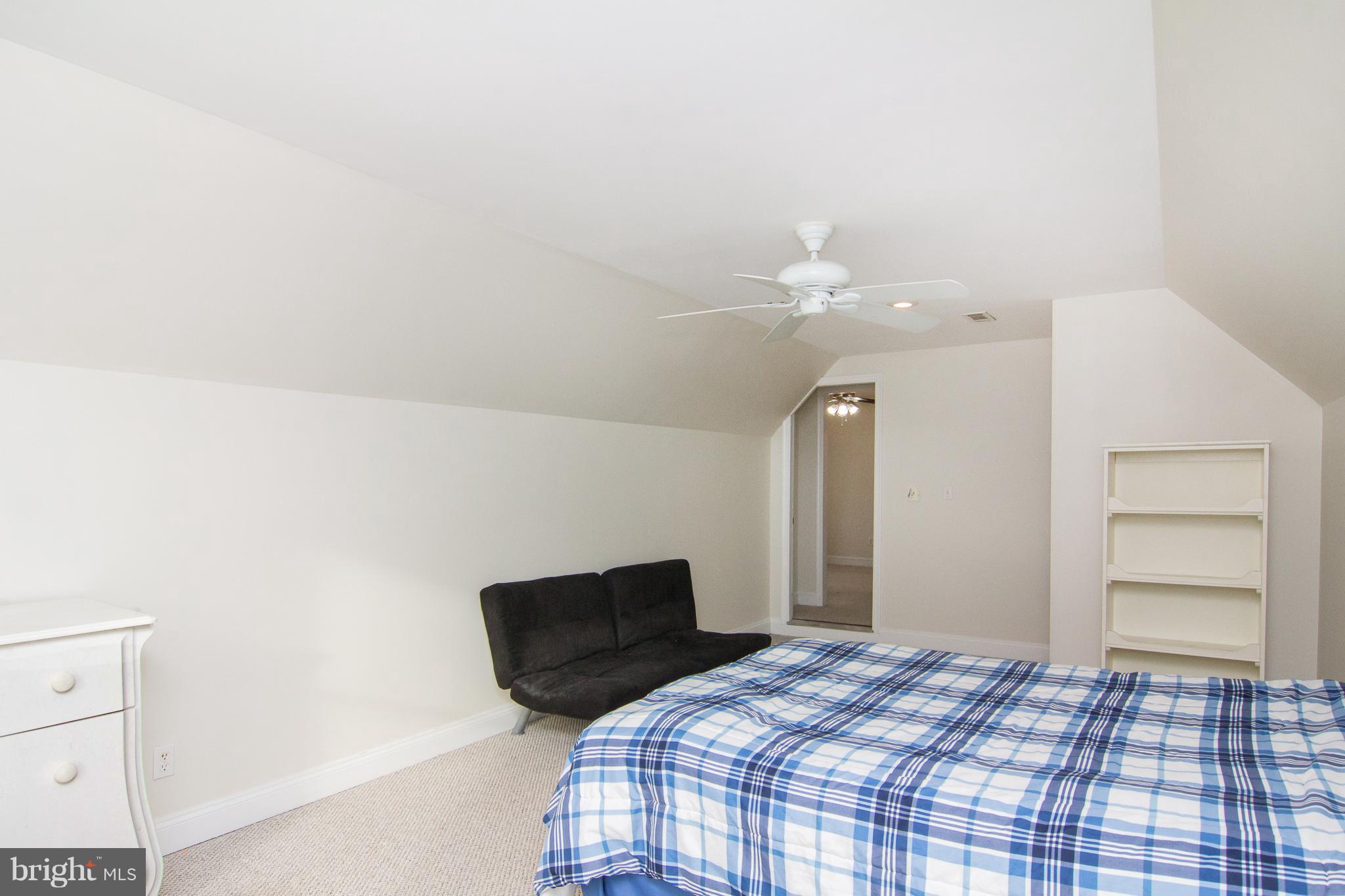 15825 Yeoho Road Sparks, MD 21152 - Photo 18 of 30 a bedroom with a bed and a chandelier