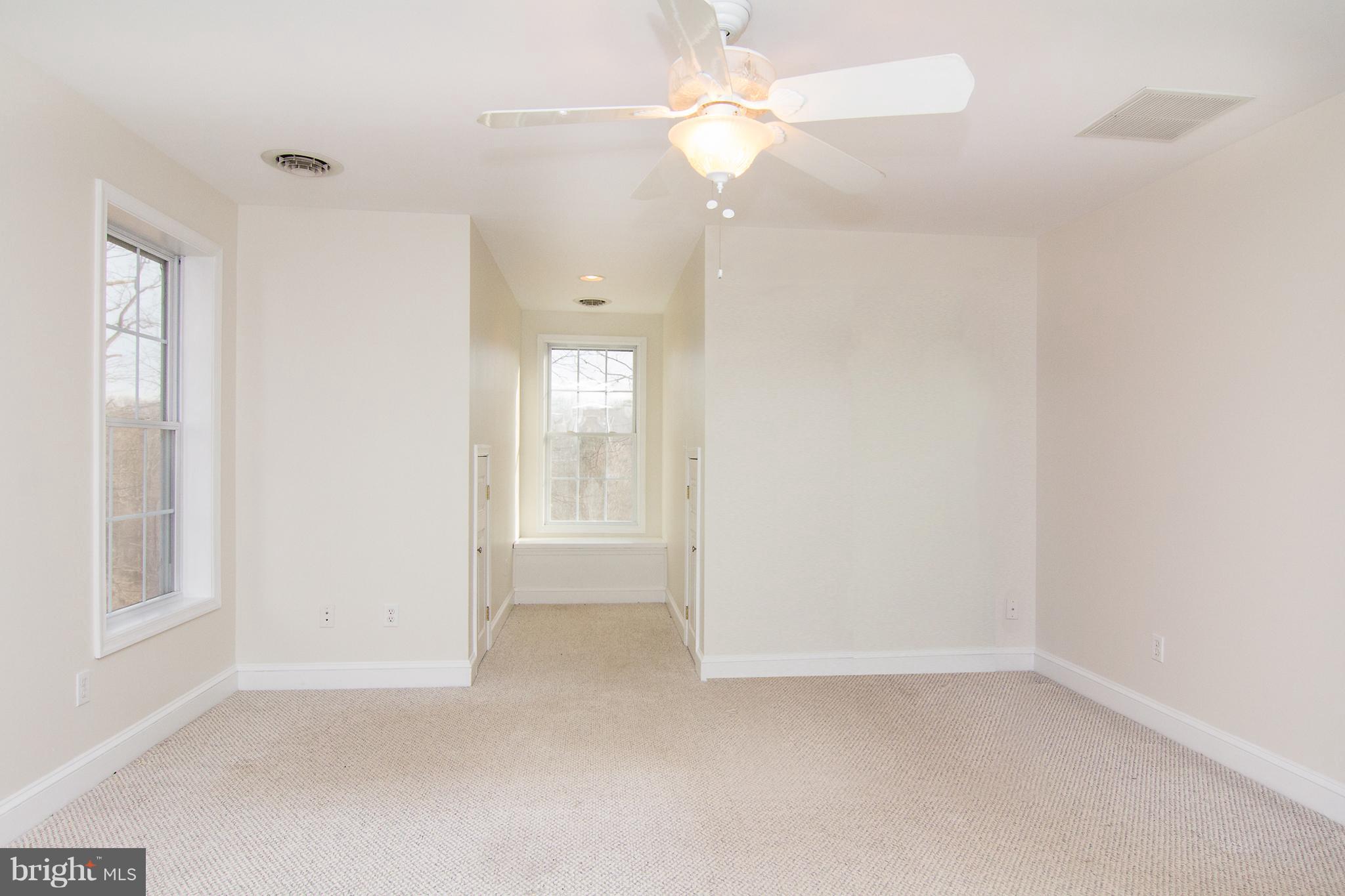 15825 Yeoho Road Sparks, MD 21152 - Photo 20 of 30 an empty room with chandelier fan