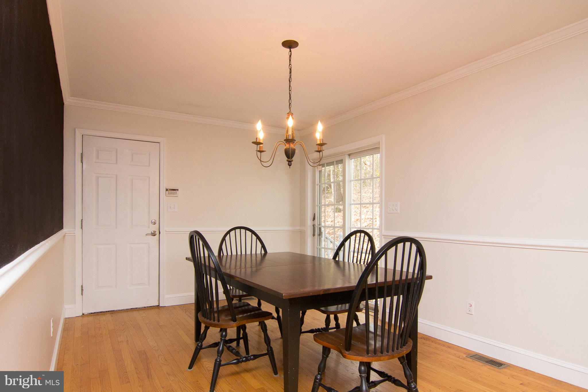 15825 Yeoho Road Sparks, MD 21152 - Photo 10 of 30 a view of a dining room with furniture and window