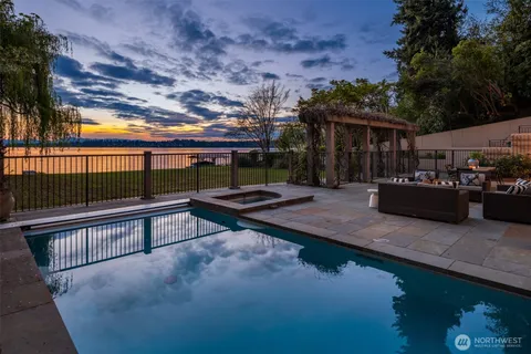 a view of a swimming pool with a patio