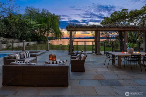 a outdoor living space with furniture and a fireplace