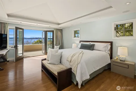 a bedroom with a large bed and a couch
