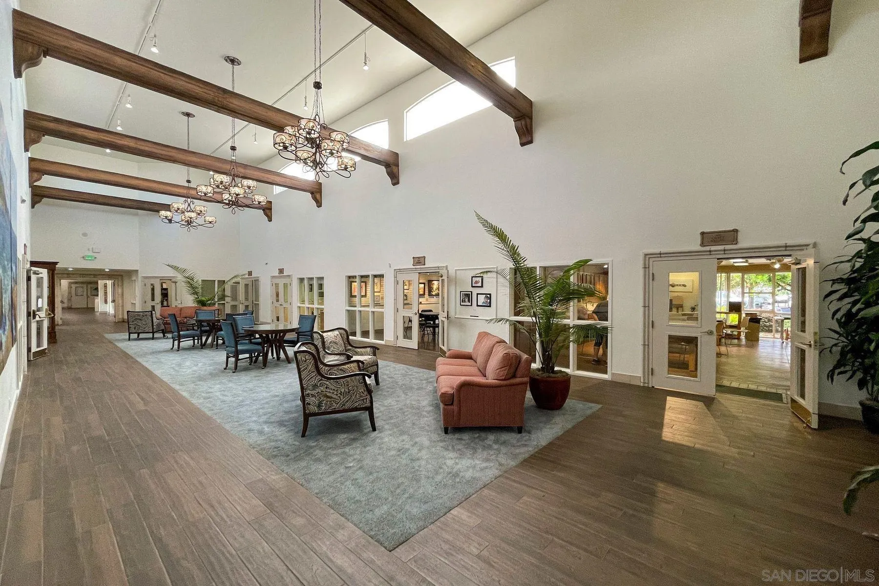 4214 Lindos Way Oceanside, CA 92056 - Photo 11 of 18 a living room with furniture and a chandelier