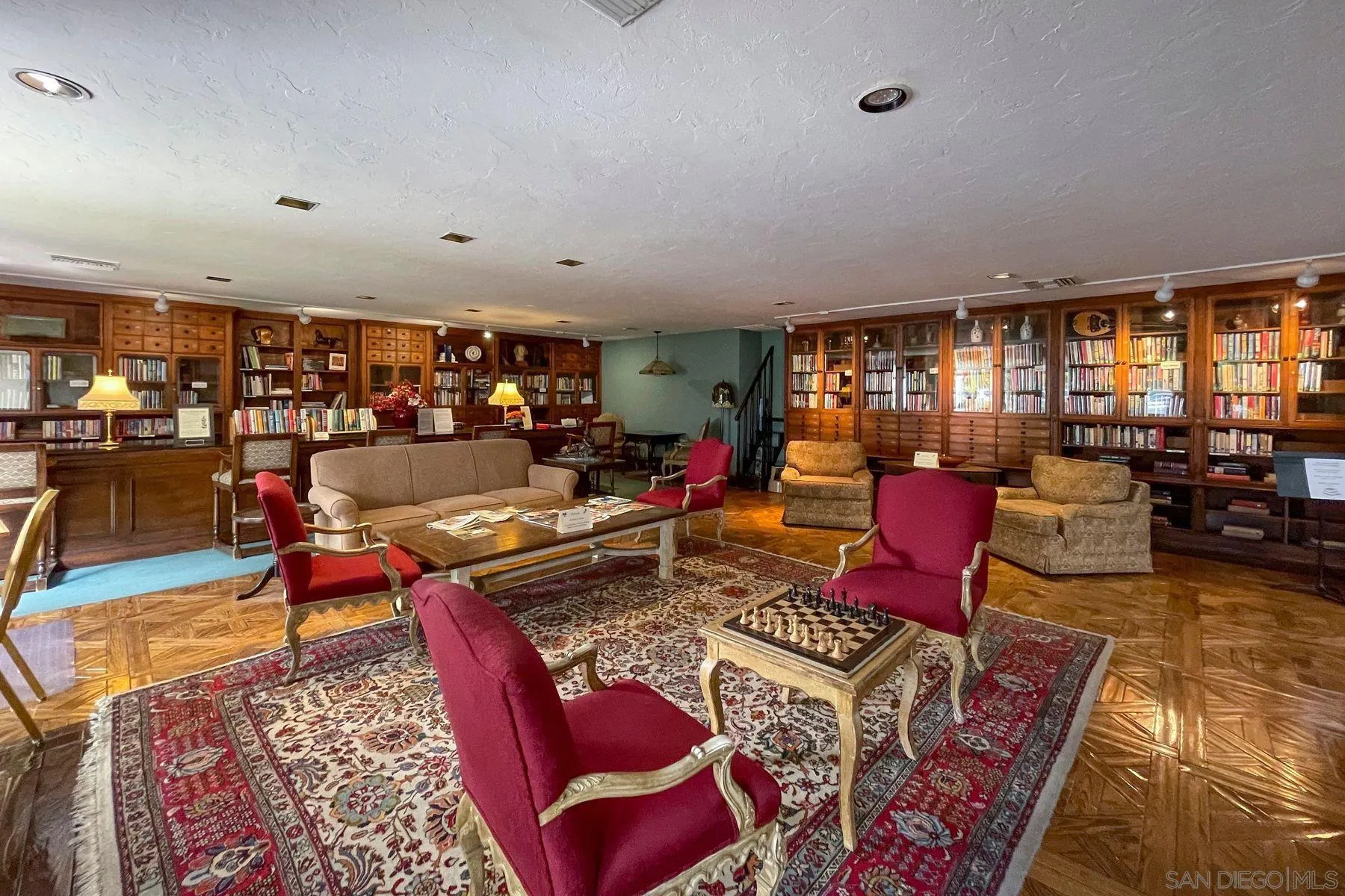 4214 Lindos Way Oceanside, CA 92056 - Photo 12 of 18 a living room with furniture a rug and a large window